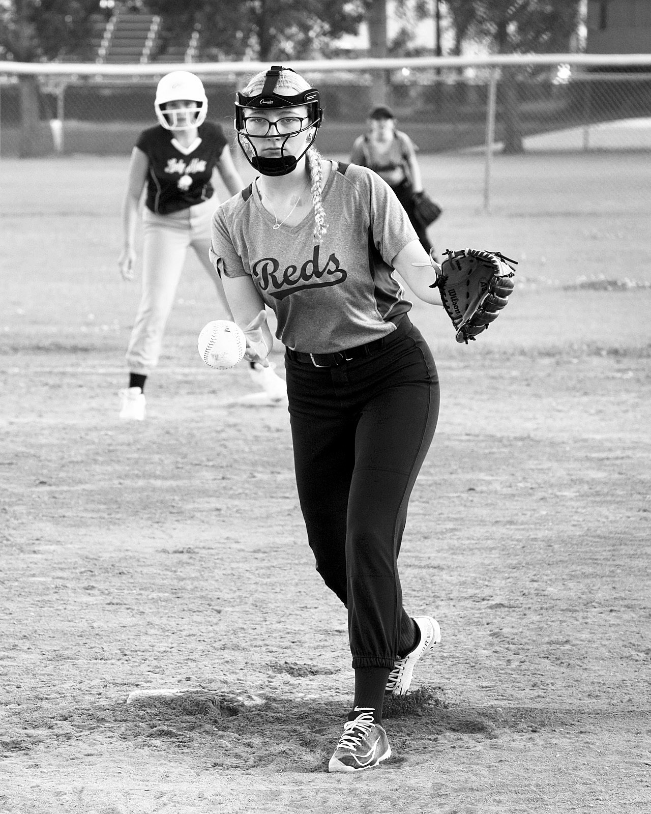 Graci Witzel delivers a strike in the Reds win in Langdon. Photo by Larry Stokke.