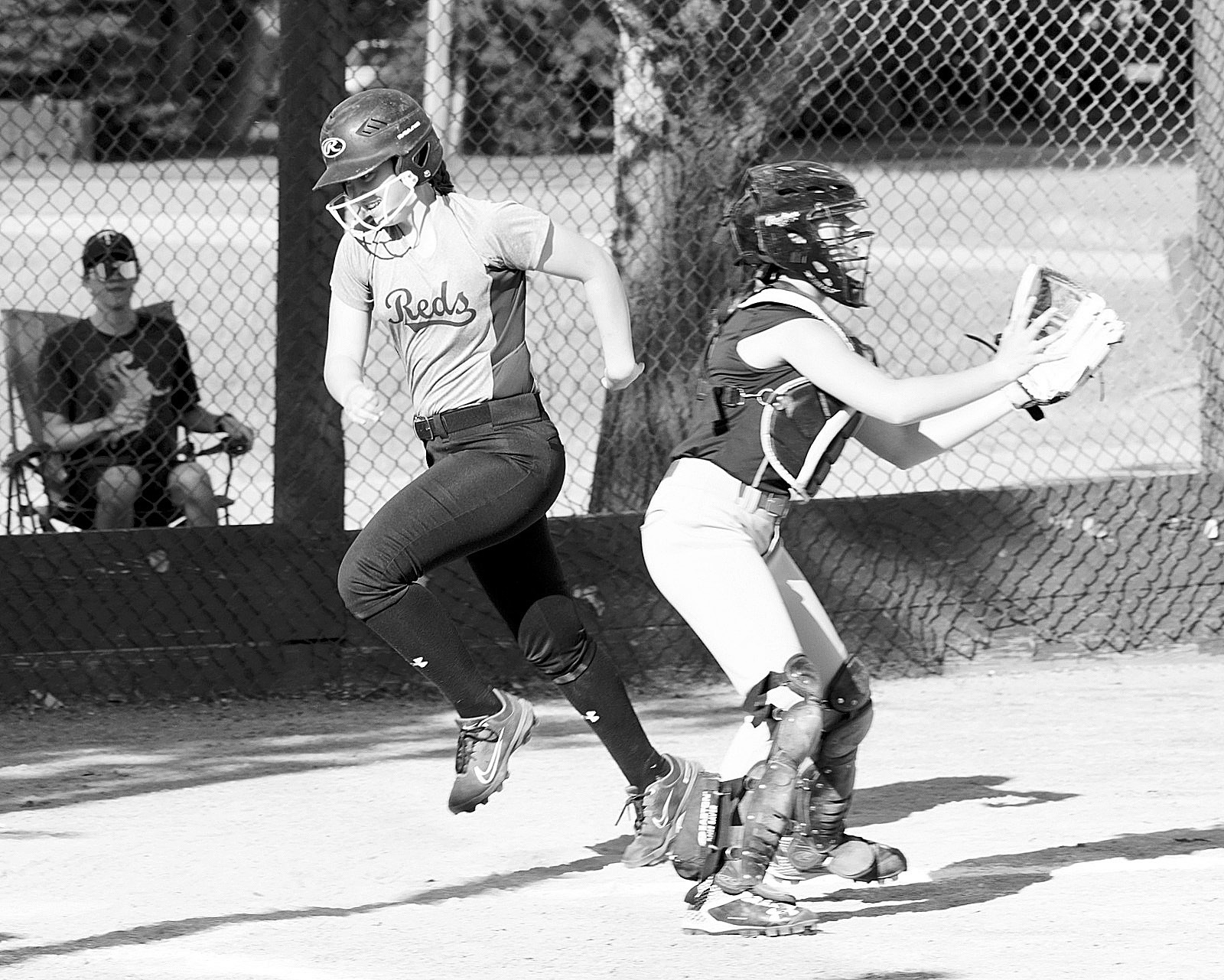 Nadia Lewis scores a run for the Langdon Reds against Valley. Photo by Larry Stokke.