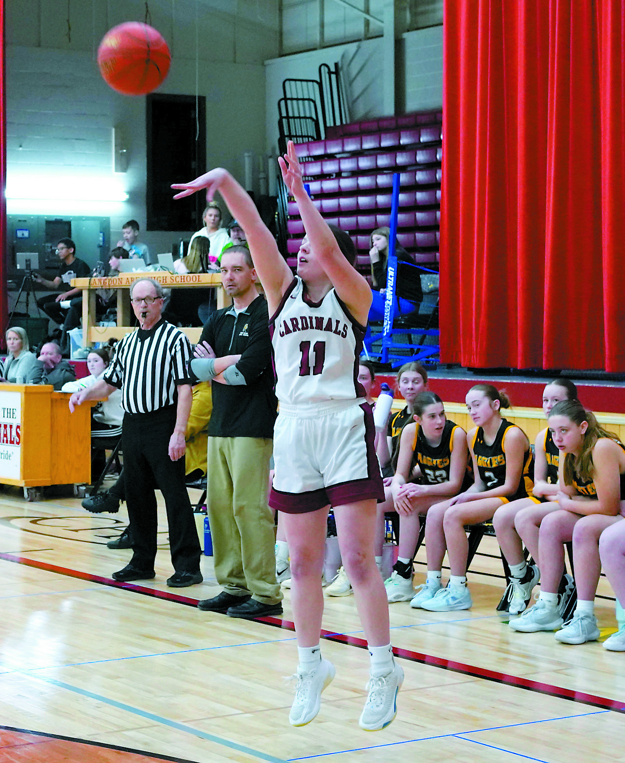 Erika Bakke fires off a shot behind the arc in the Cards' win over Park River on Jan. 28 in Langdon. Photo by Larry Stokke.