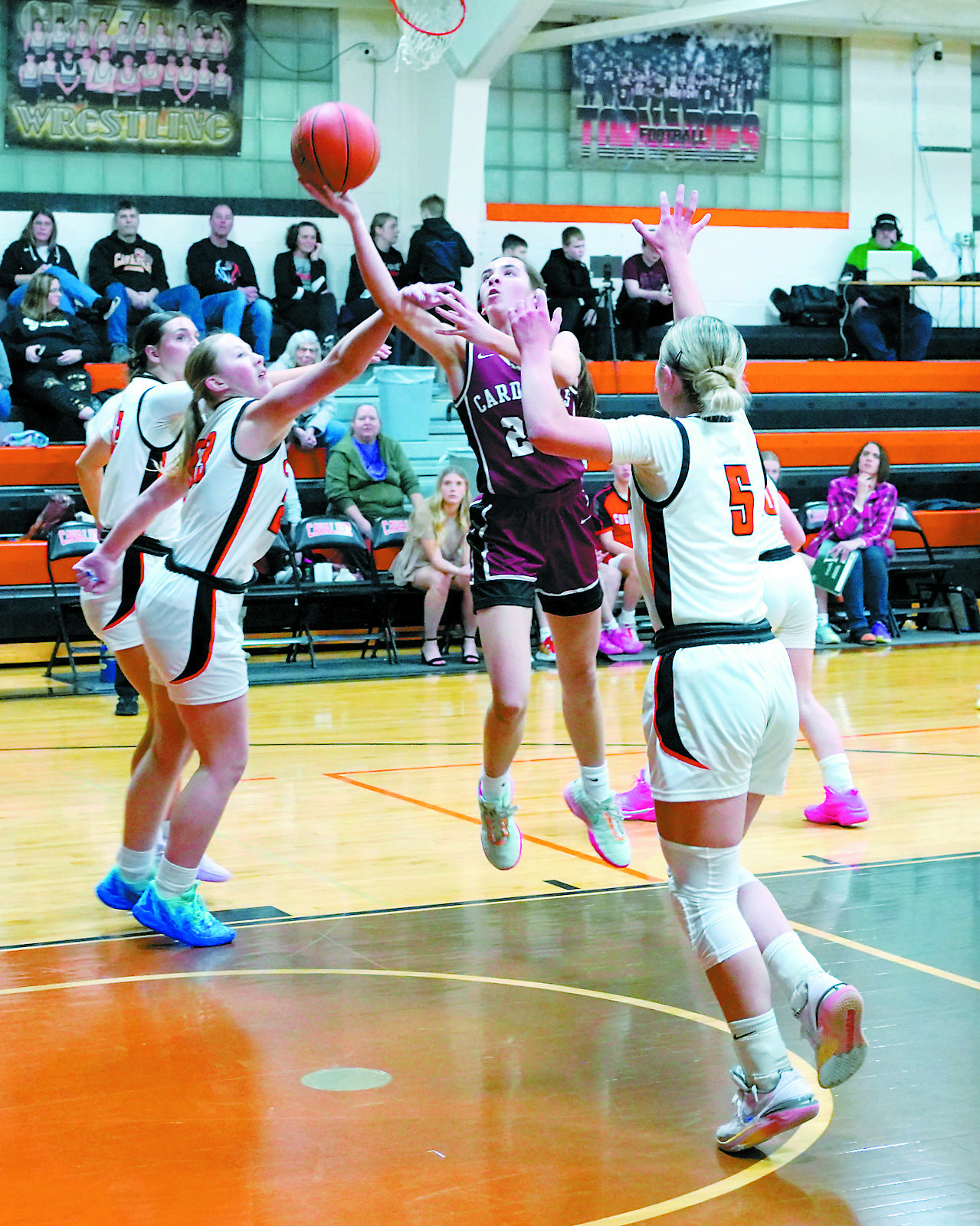 Avery Lorenz rolls in a layup and finished the win over Cavalier with a game high of 18 points. Photo by Larry Stokke.