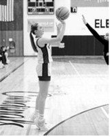 Hallie Overby drops in a 3-point basket Saturday, Feb. 7 in the last home game of the year. Photo by Larry Stokke