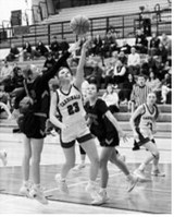 Hallie Overby sneaks a layup past the tough Honkers defense on Feb.7. Photo by Larry Stokke