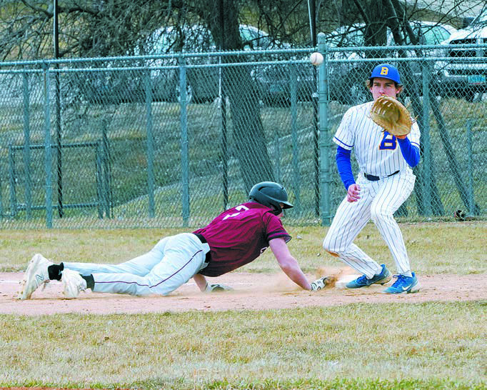 Dawson Hein tags the bag beating the ball back to the first baseman. Photo by Larry Stokke.