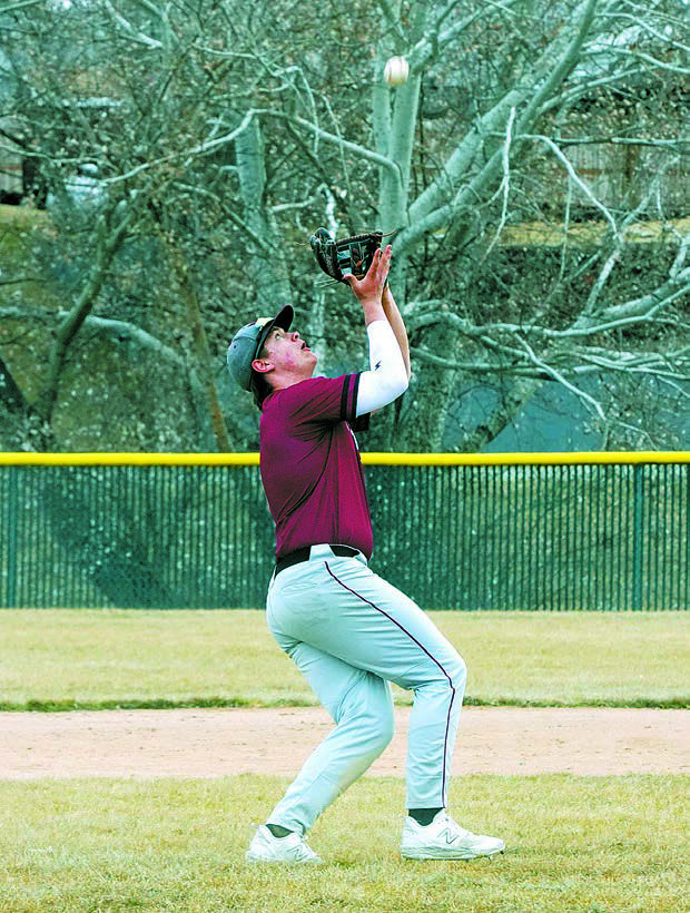 Theo Romfo makes a catch in center field for a third out against Hazen. Photo by Larry Stokke.