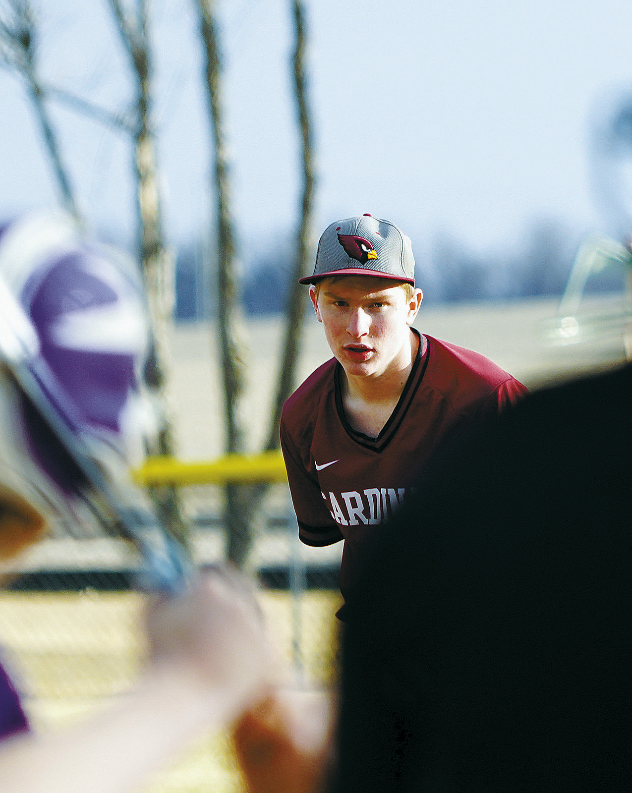Levi Swanson eyes the batter before delivering a strike. Photo by Larry Stokke.