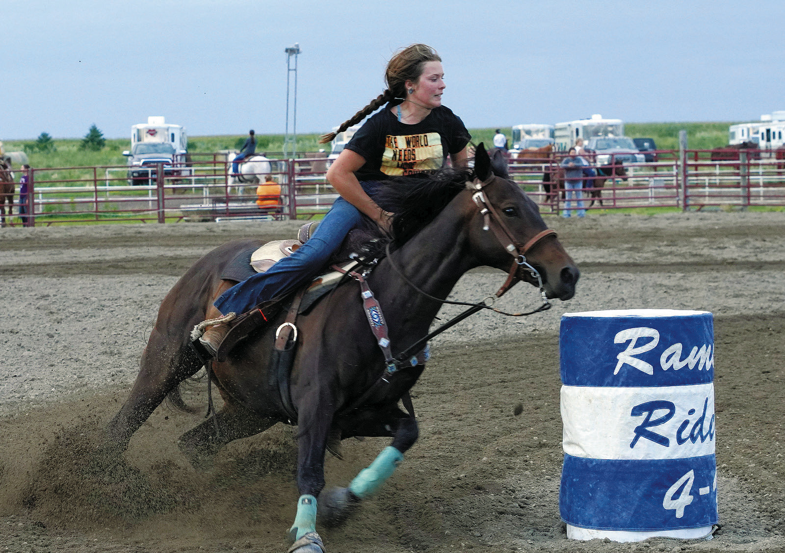 Gracee Thorlakson rounds a barrel on her horse, Harley. Photo by Larry Stokke.