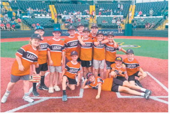 The Langdon Red Sox celebrate their runner-up finish at the Cal Ripken Midwest Plains Regional Tournament in Sioux Falls, South Dakota.