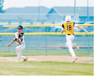 Finn Lorenz makes a catch at first base. Photo by Larry Stokke