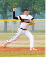 Luke Gilseth traded his catcher's mask for the pitcher's mound, winding up and throwing a strike during a game in Grafton on July 16. Photo by Larry Stokke