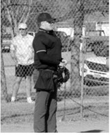 Grant Romfo was behind the plate calling balls and strikes in the game between PCN and Park River. Photo by Larry Stokke