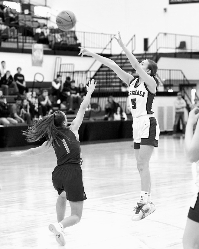 Kemi Morstad shoots from the top of the key and adds a basket to her 13-point night against Linton-HMB. Photo by Larry Stokke.