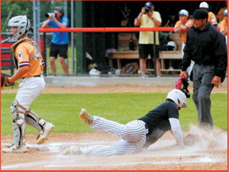 Devin Hakanson slides safely into base as the umpire watches the play. Photo by Larry Stokke