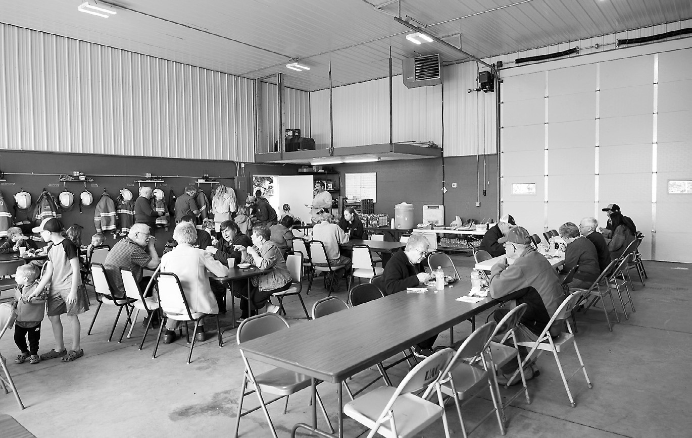 Attendees enjoying their meal in the Fire Hall.