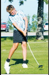 Merek Mostad tees off during the St. Alphonsus Golf Tournament on July 13. Photo by Larry Stokke