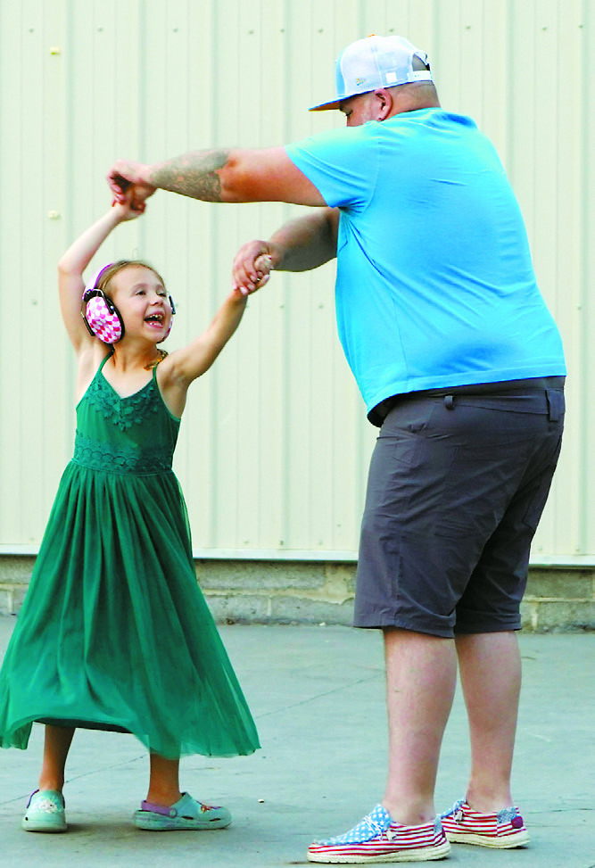 Music Fest attendees dance to the tunes of Grampa's Amp on Saturday. Photo by Larry Stokke.