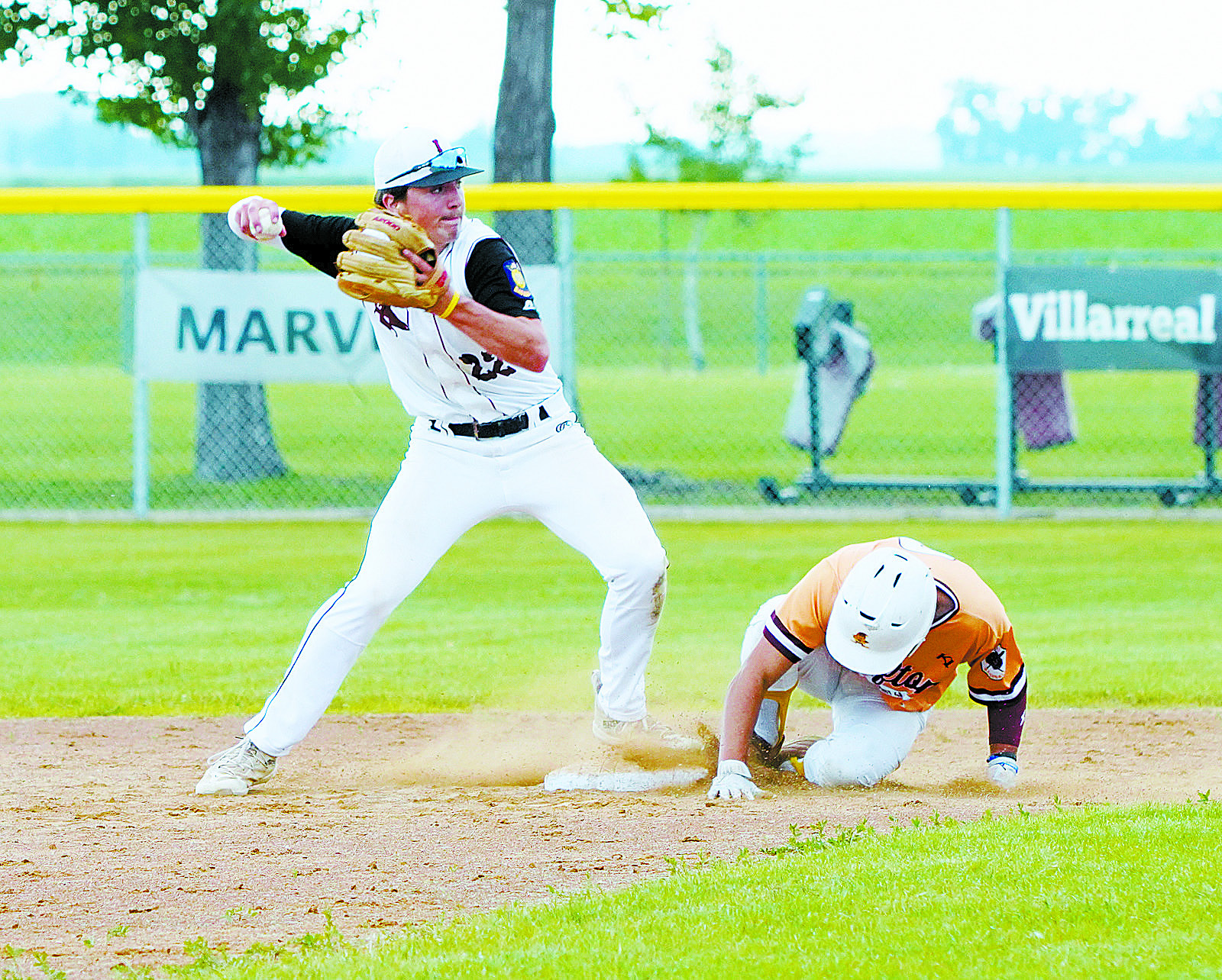 Mason Romfo puts out a Grafton player at 2nd base. Photo by Larry Stokke.