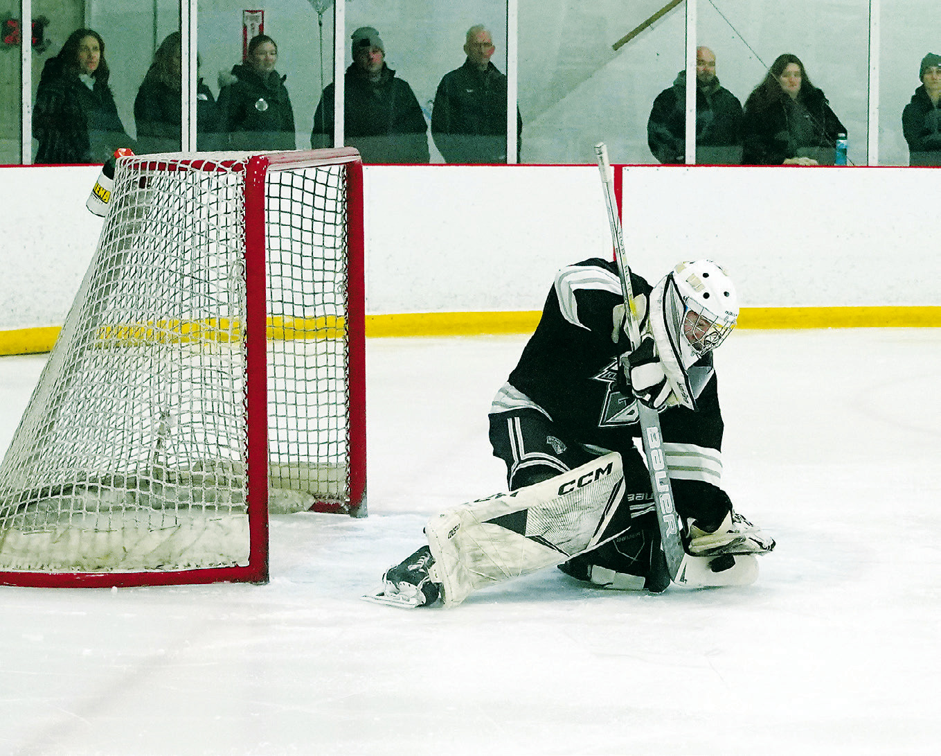 Ryder Moser stops the puck with a great stick save in the win over Fargo. Photo by Larry Stokke.