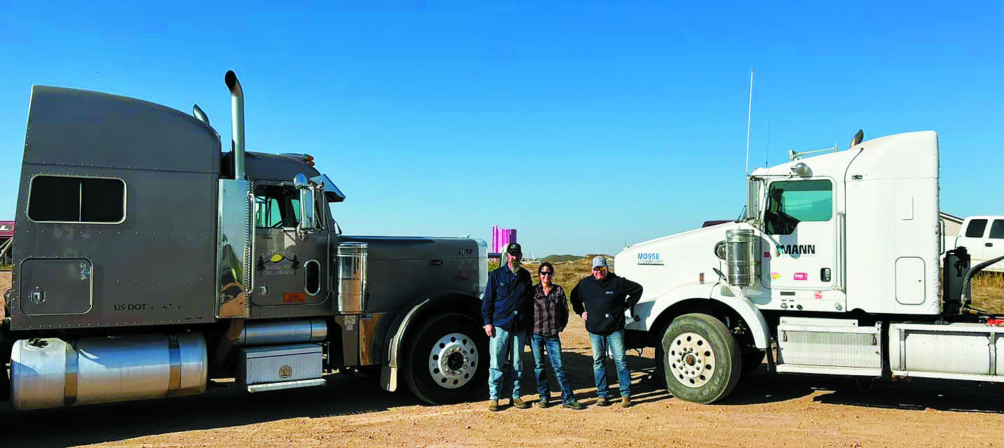 Freddie and Shauna Gentry (left) along with Garrett Romelle with trucks from S&amp;F Trucking and Mann Energy used to gather relief supplies donated from across North Dakota. Freddie and Shauna left North Dakota bound for North Carolina on Oct. 21. Contributed by Shauna Gentry.