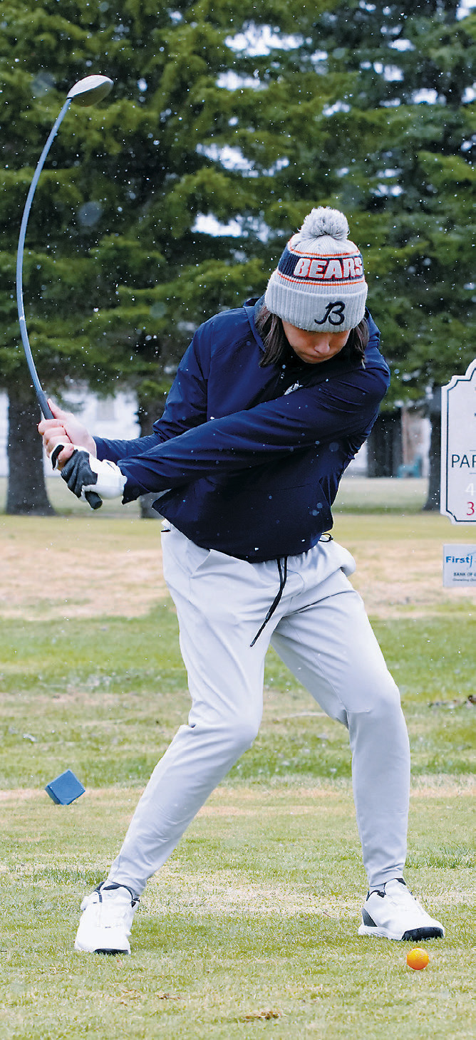 Zander Duerre tees off during the Dave Osborn Invitational in Cando on May 5. Photo by Larry Stokke