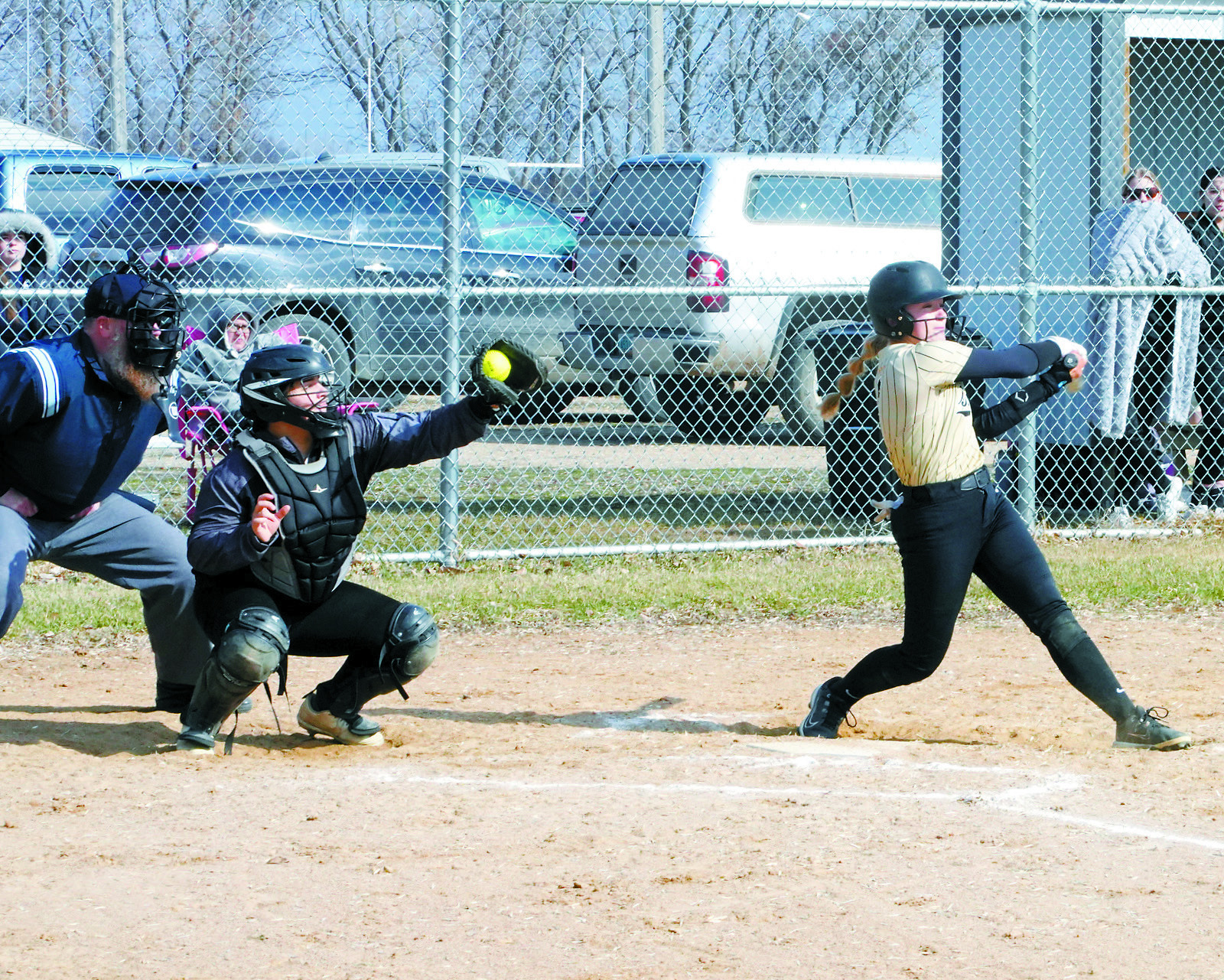 Kenadee Cluchie gloves a strike ball in the game against North Border in Cavalier on April 14. Photo by Larry Stokke.