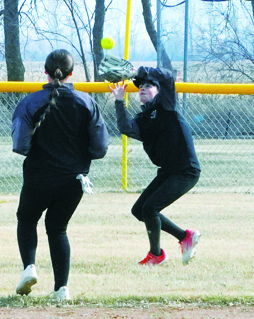 Lilly Zimmer catches a ball sent deep into left field for an out against the North Border Grizzlies. Photo by Larry Stokke.
