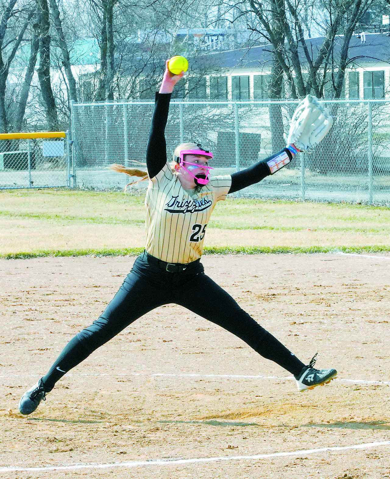 Sara Jenson eyes the batter and sends a strike across the plate. Photo by Larry Stokke.