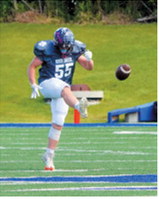 Gavin Symington kicks off after the East's nine-man team scored a touchdown during the Shrine Bowl on June 20. Photo by Larry Stokke