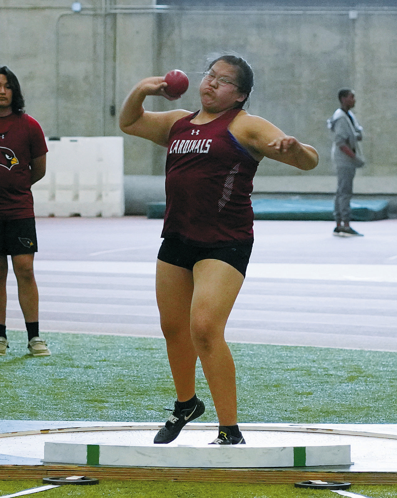 Performer of the Meet for the Cards, Christine Joyner, placed 2nd in the shot put throwing 33' 1'. Photo by Larry Stokke.