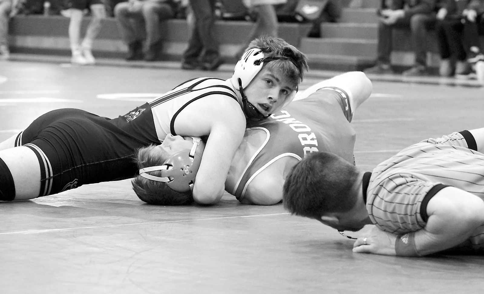 Zeke Symington pinned his Bronco opponent in the Regional competition to qualify for the state tournament. Photo by Larry Stokke.