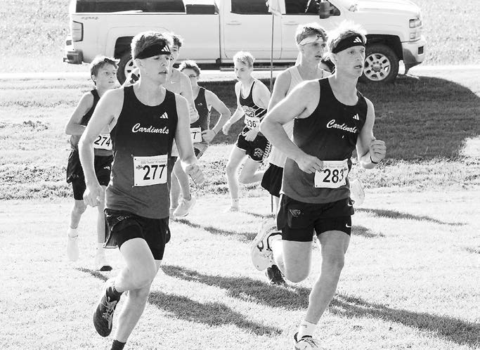 Noah Foster and Ty Ramberg ran side by side at the start of the meet with Ty placing 33rd and Noah finishing in 45th at the Northwood Meet. Photo by Larry Stokke.