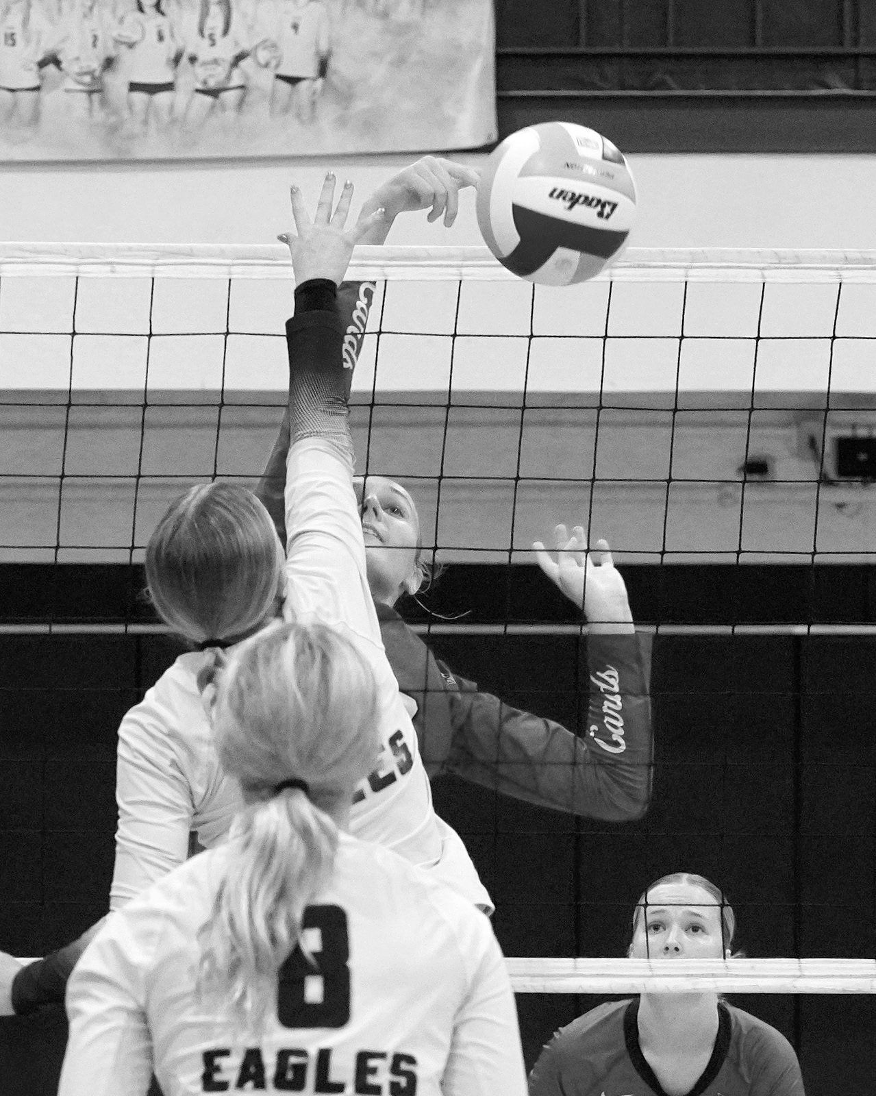 Kemi Morstad with a nice stuff block in the Cards win over the Eagles in Walhalla. Photo by Larry Stokke.