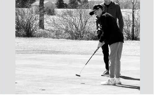 Dyson Askvig sinks a putt at Creel Bay April 29. Photo by Larry Stokke.