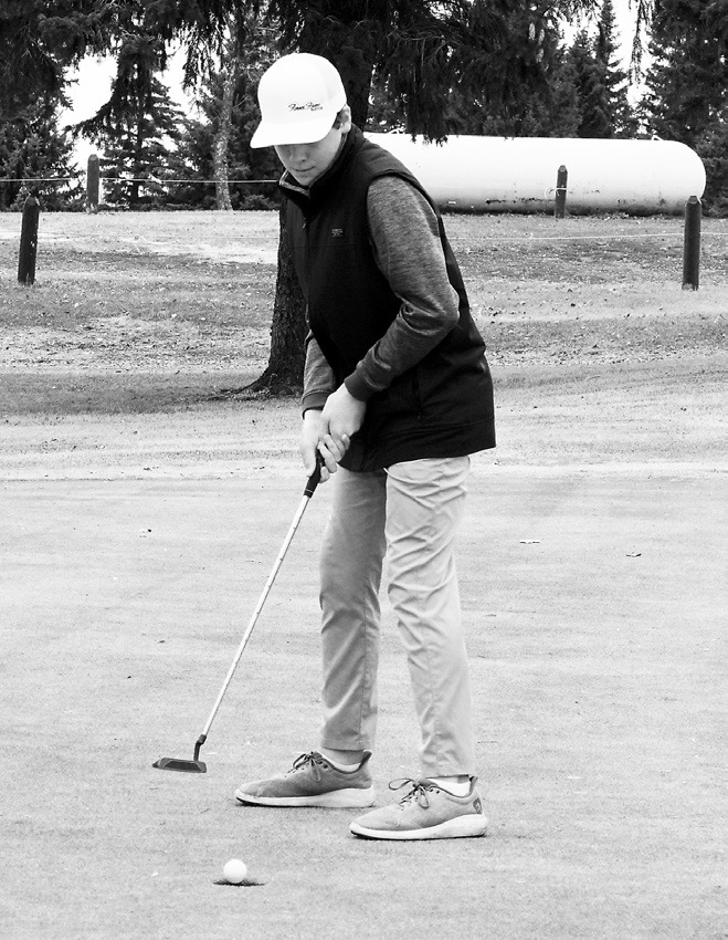 Ryder Moser sinks a putt at Creel Bay and shot an 84 where he finished in a three-way tie for 11th place. Photo by Larry Stokke.