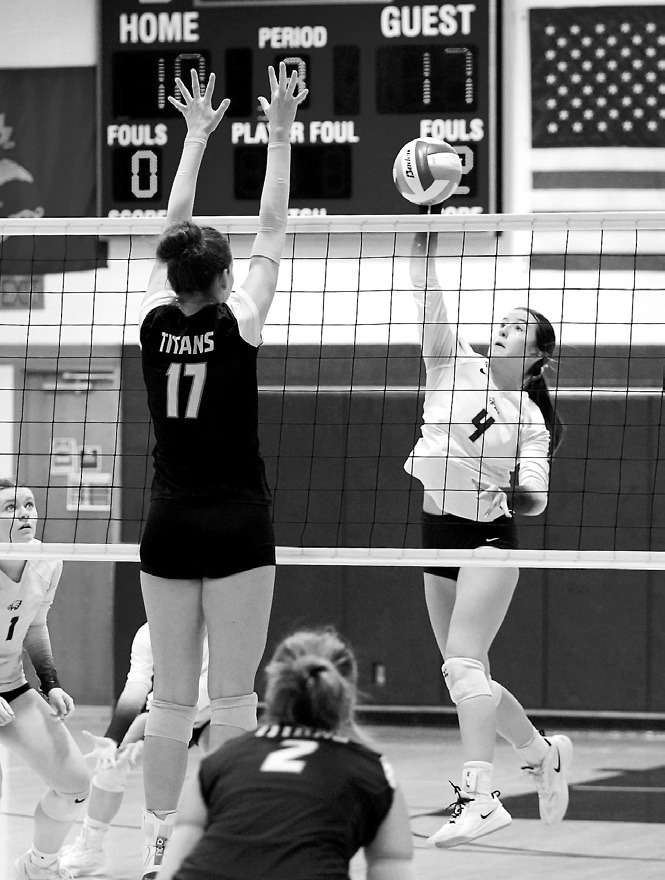 Jaelyn Johnson sends one of her eight kills over the net in the Eagles’ game against the DVE Titans. Photo by Larry Stokke.
