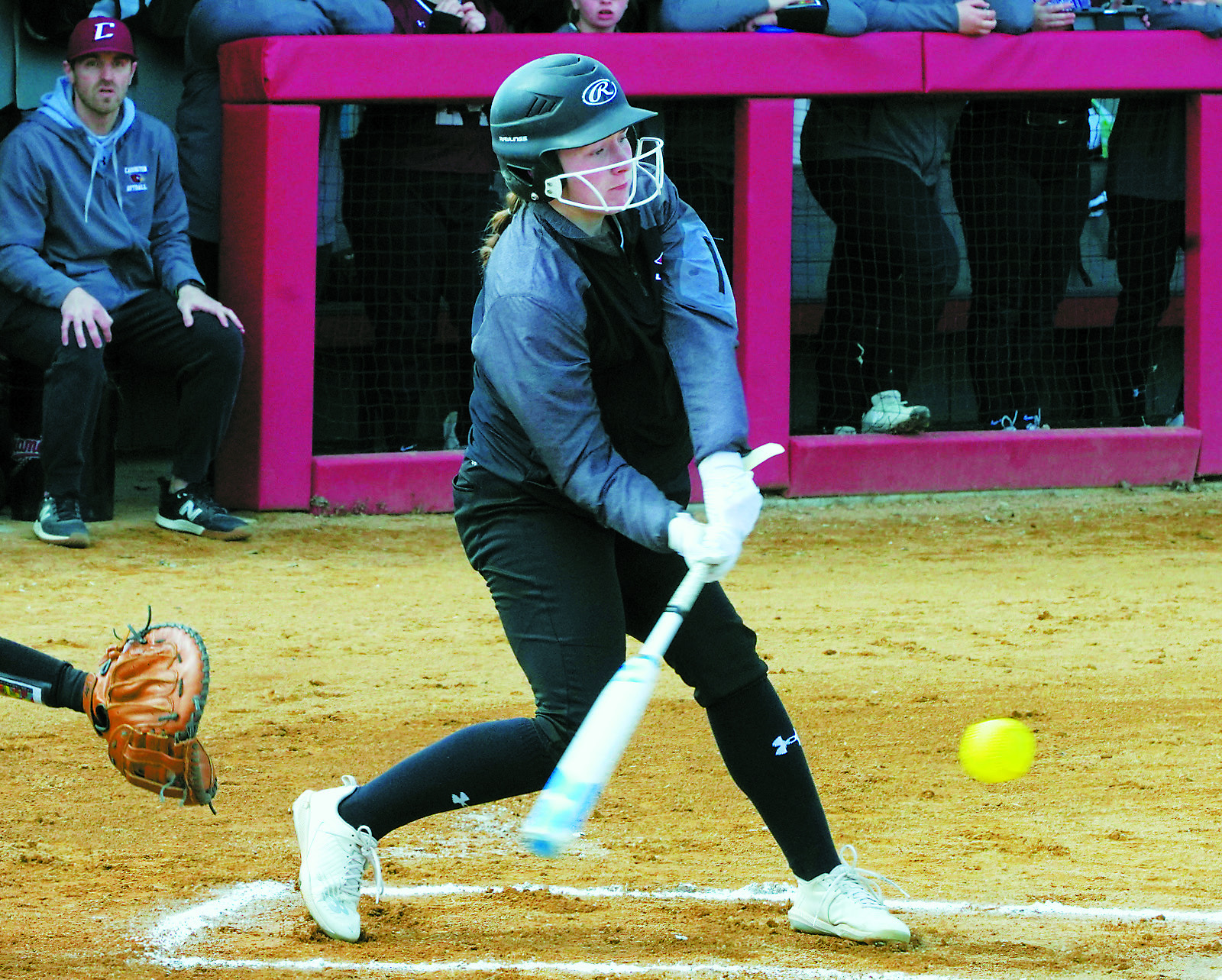 Meredith Romfo connects for a base hit against the Carrington Cardinals on April 22. Photo by Larry Stokke.