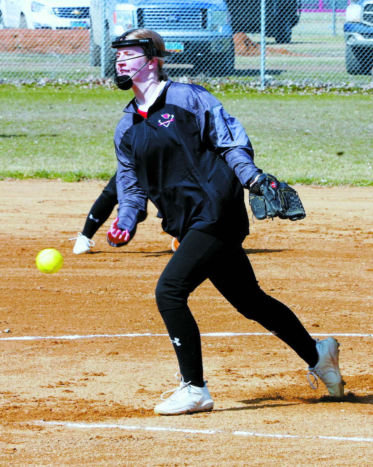 Tallia Johnston eyes the batter and sends a strike across the plate. Photo by Larry Stokke.
