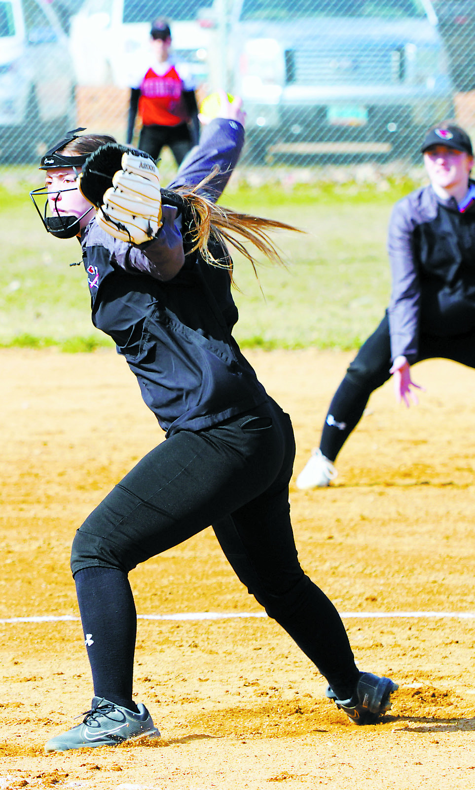 Nadia Lewis winds up and delivers a third strike. Photo by Larry Stokke.