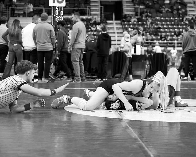 Jalyn Carigan pins her opponent and picks up a win. Photo by Larry Stokke. Tia Hugley in the 136 lb. weight class made quick work of her opponent and pinned her for the win. Photo by Larry Stokke.