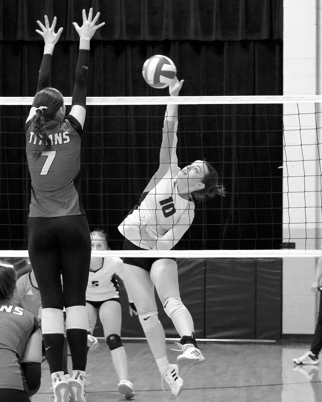 Ava Kemnitz leaps and adds a point for the Tornadoes. Photo by Larry Stokke.