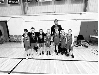 The fourth-grade boys took first place in the Langdon Dakota Frost Tournament. L-R: Cash Feil, Jaxtin Overby, Calvin Moline, Brexten Bjornstad, Henry Lorenz, Jack Schaefer, Myles Martin Coach Justin Overby Submitted photo