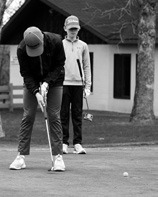 Zeke Symington with a nice putt to help North Border land a 3rd place team finish at the Larimore Meet. Photo by Larry Stokke.