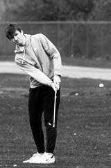 Keaton Ullyott hits a chip shot to get the ball near the pin. Photo by Larry Stokke.
