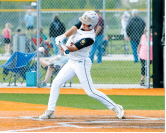 Dawson Downs drives a base hit into the outfield during action against Park River. Photo by Larry Stokke