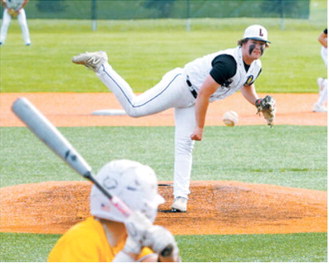 Devin Hakenson delivers a strike during action against Park River. Photo by Larry Stokke