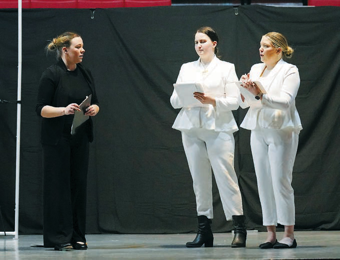 The Auditor (left) Madilyn Crump talks with Associate One and Two, Melah Mackall (middle) and Kiera Lien (right). Photo by Larry Stokke.