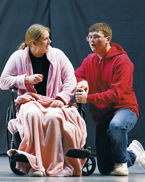 Michael St. John played by Brayden Harris, argues with his sister, played by Claire Mehlhoff. Photo by Larry Stokke.