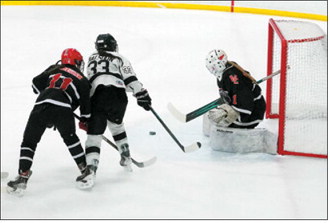 Hayden Balsdon gets in front of the Oilers net and gets off a shot. Photo by Larry Stokke