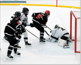 FM Bank Player of the Game Ella Brekke blocks the Watford City Oilers attempt at scoring a goal Saturday, Jan. 17 in Langdon. Photo by Larry Stokke