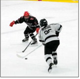 Kenadee Cluchie brings the puck up the ice and gets around an Oilers defender. Photo by Larry Stokke