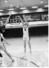 Colton Bailly pulls up from beyond the arc and buries a three point basket. Photo by Ashley Schafer